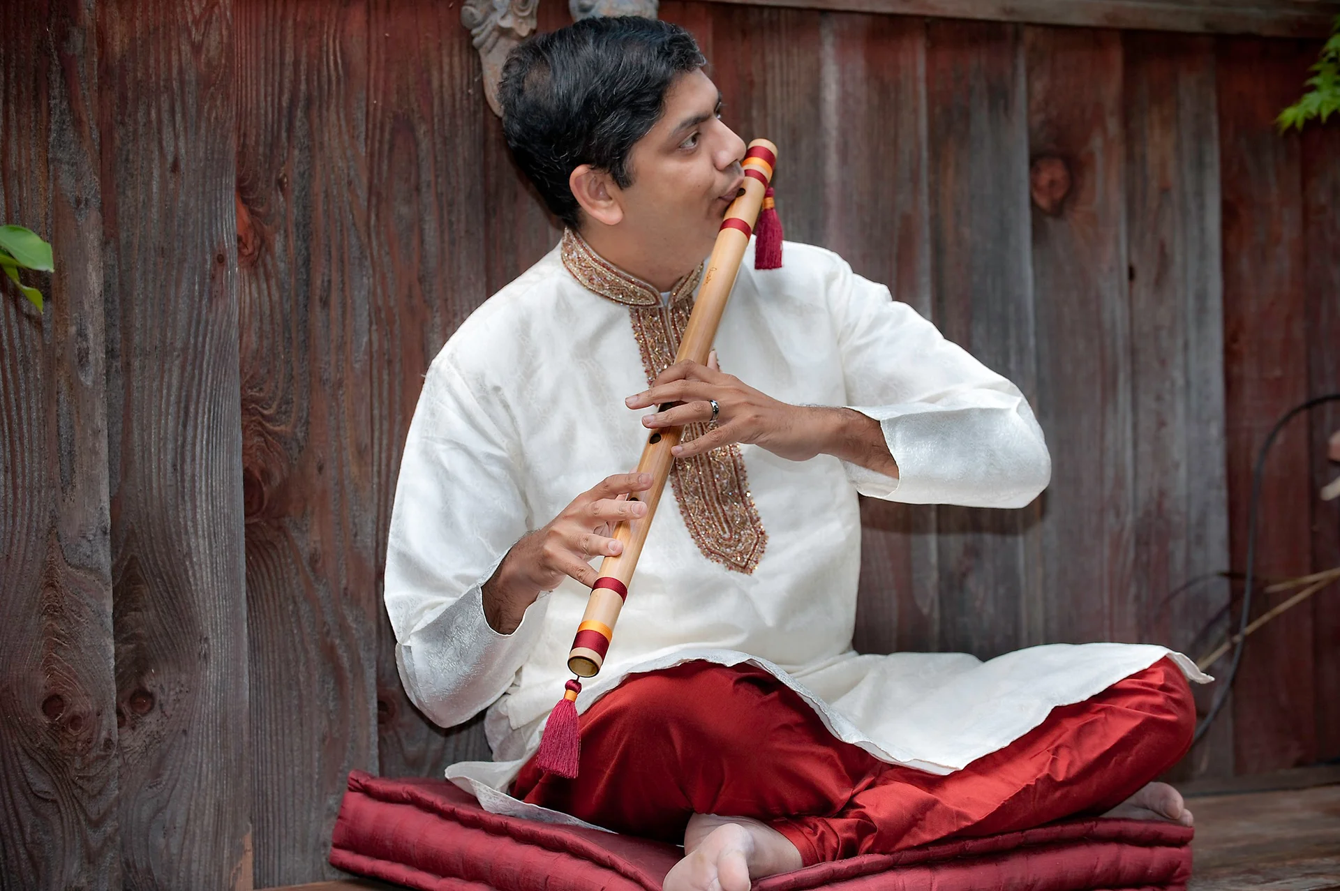 Prasad seated with bansuri