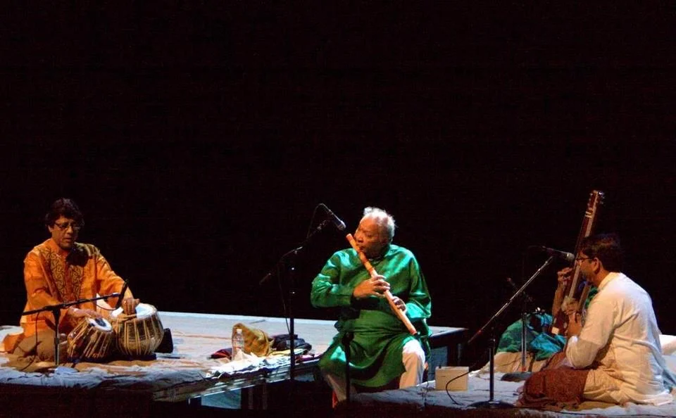 Musicians performing together on stage