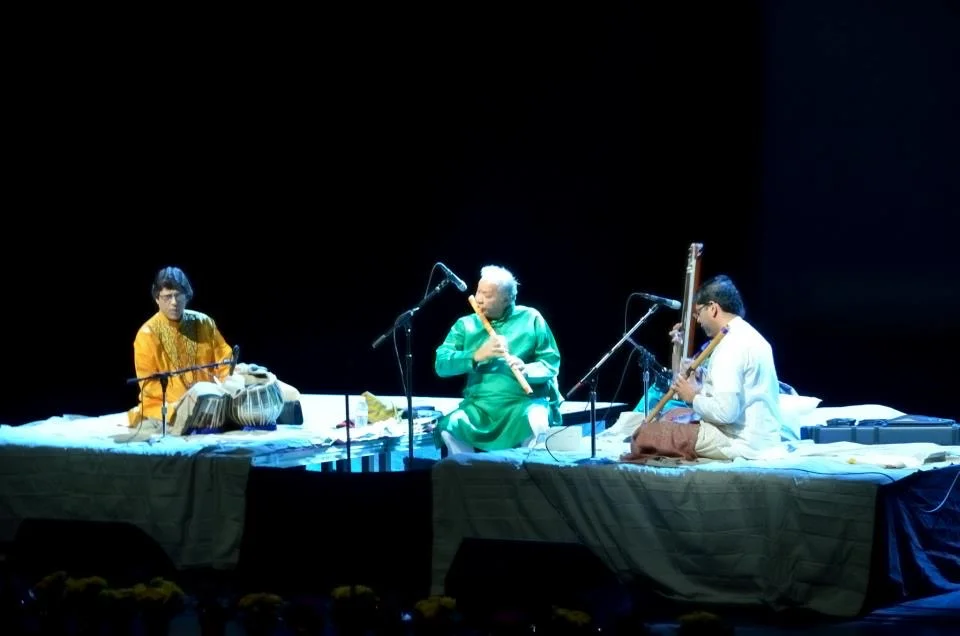 Musicians performing together on stage